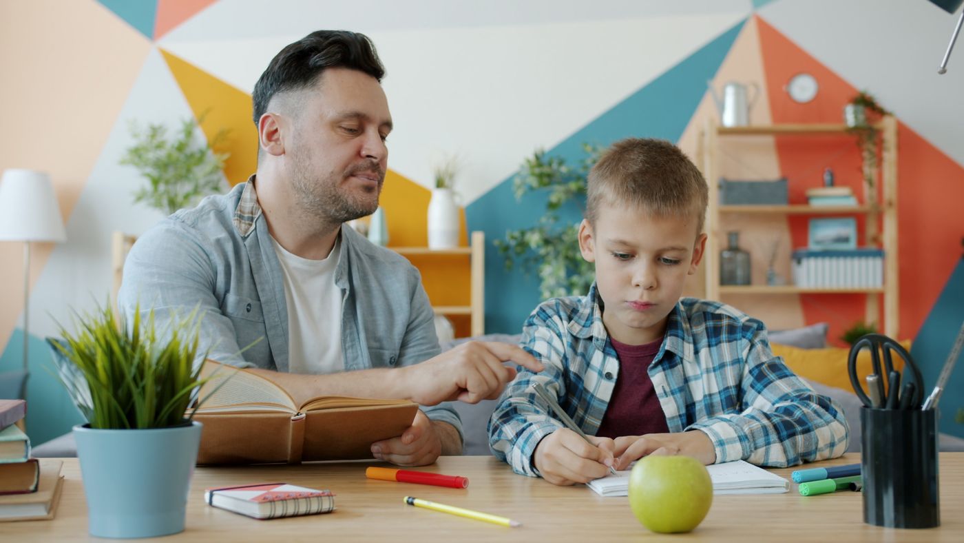 Parent helping a student with homework at home